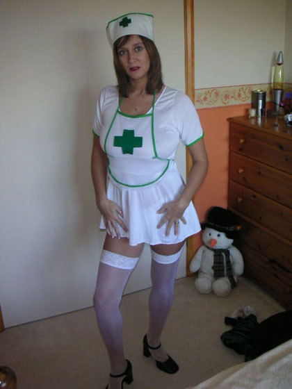 This sexy naughty Milf is wearing a little nurses uniform. She is playful in the bedroom, there are lots of upskirt shots. She is wearing se