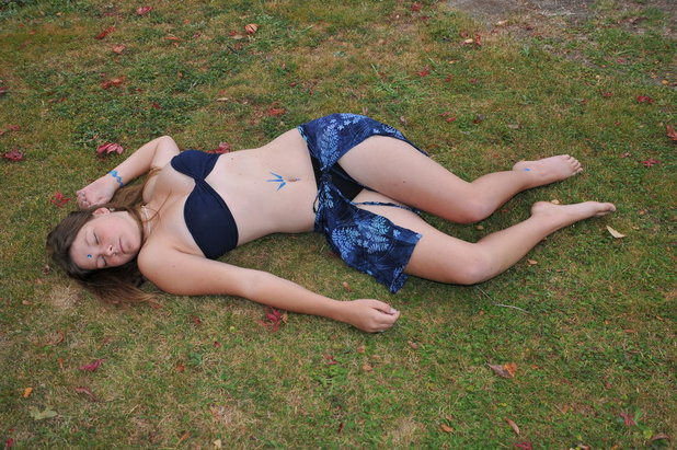 Girl lied down on the grass
